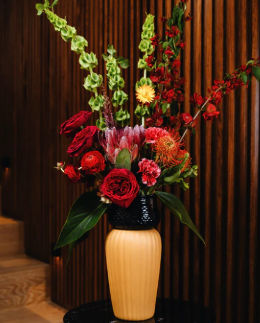 Floral arrangement with red flowers on a restaurant